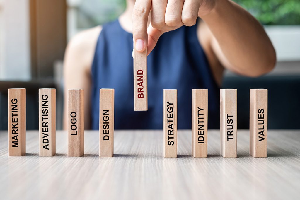  business woman hand, placing wooden domin.